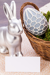 Image showing Easter still life with a silver bunny and eggs