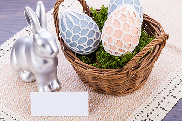 Image showing Easter still life with a silver bunny and eggs