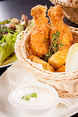 Image showing Crisp crunchy golden chicken legs and wings