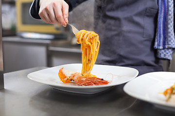 Image showing Chef plating up seafood pasta