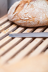 Image showing homemade fresh baked bread and knife 