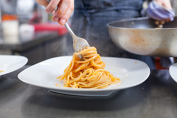 Image showing Chef plating up seafood pasta