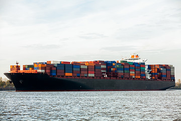 Image showing Fully laden container ship in port