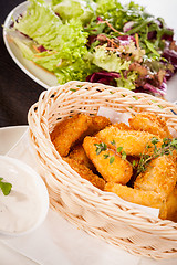 Image showing Crumbed chicken nuggets in a basket