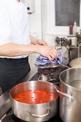 Image showing Cooking in a commercial kitchen