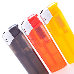 Image showing Vividly coloured plastic lighters