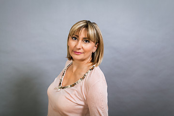 Image showing Smiling confident middle-aged blond woman