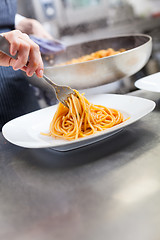 Image showing Chef plating up seafood pasta