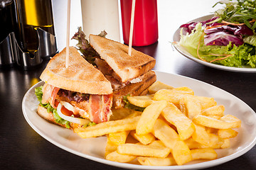 Image showing Club sandwich with potato French fries