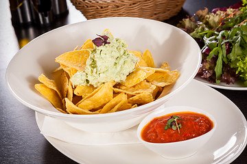 Image showing Crisp corn nachos with guacamole sauce