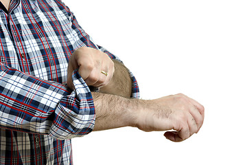 Image showing Man rolls up sleeves