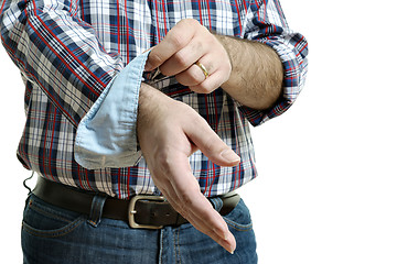 Image showing Man rolls up sleeves