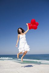 Image showing Jumping with red ballons