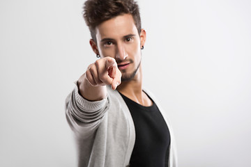 Image showing Young man pointing