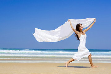 Image showing Jumping with a white scarf