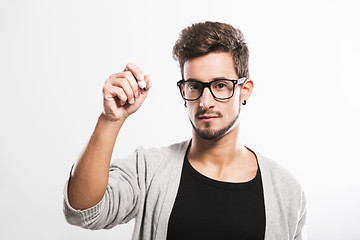 Image showing Young man writing on a glass