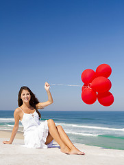 Image showing Girl with red ballons