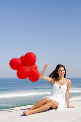 Image showing Girl with red ballons