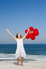 Image showing Beautiful girl holding red ballons