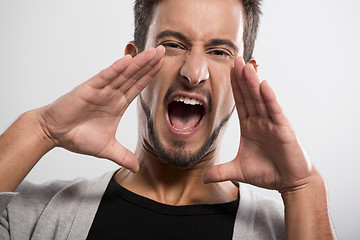 Image showing Young man shouting