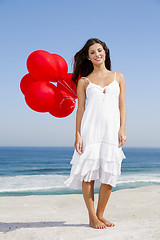 Image showing Beautiful girl holding red ballons