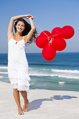 Image showing Beautiful girl holding red ballons