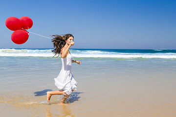 Image showing Running with ballons