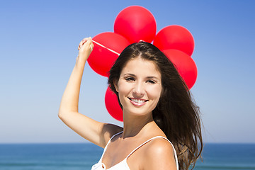 Image showing Beautiful girl holding red ballons