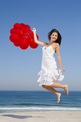 Image showing Jumping with red ballons