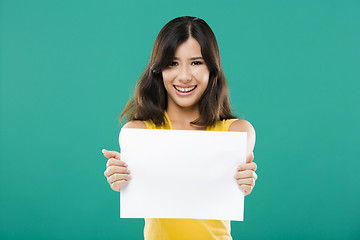 Image showing Holding a blank paper