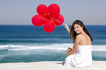 Image showing Girl with red ballons