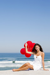 Image showing Girl with red ballons