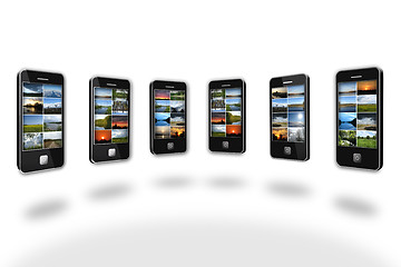 Image showing Modern mobile phones with different images