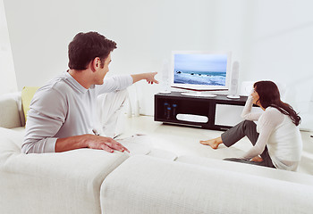 Image showing couple on sofa and watching tv