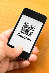 Image showing QR code coupon on mobile