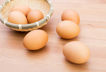 Image showing Brown egg in basket