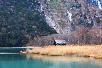 Image showing Beautiful lake with wooden house 