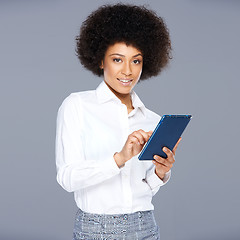 Image showing Attractive Afro-American woman with a tablet