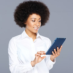 Image showing Beautiful African American woman using her tablet