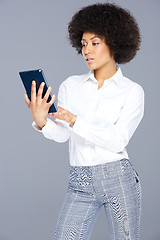 Image showing Attractive Afro-American woman with a tablet