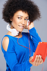 Image showing Beautiful African American woman with her music