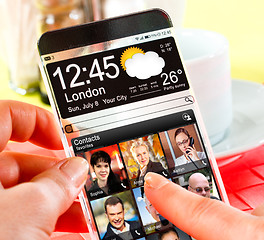 Image showing Smartphone with transparent screen in human hands.