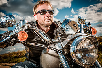 Image showing Biker on a motorcycle