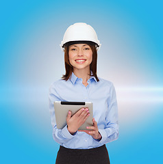 Image showing young smiling businesswoman in white helmet