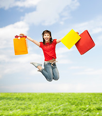 Image showing excited girl with shopping bags