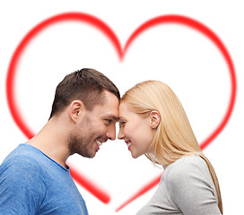 Image showing smiling couple looking at each other