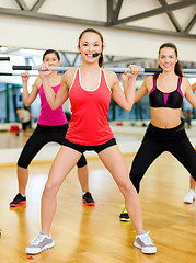 Image showing group of people working out with barbells