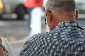 Image showing Reading a Newspaper