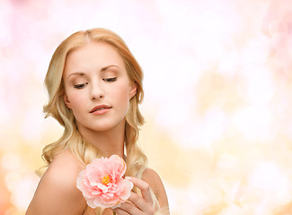 Image showing lovely woman with peony flower