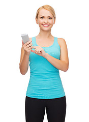 Image showing sporty woman with smartphone